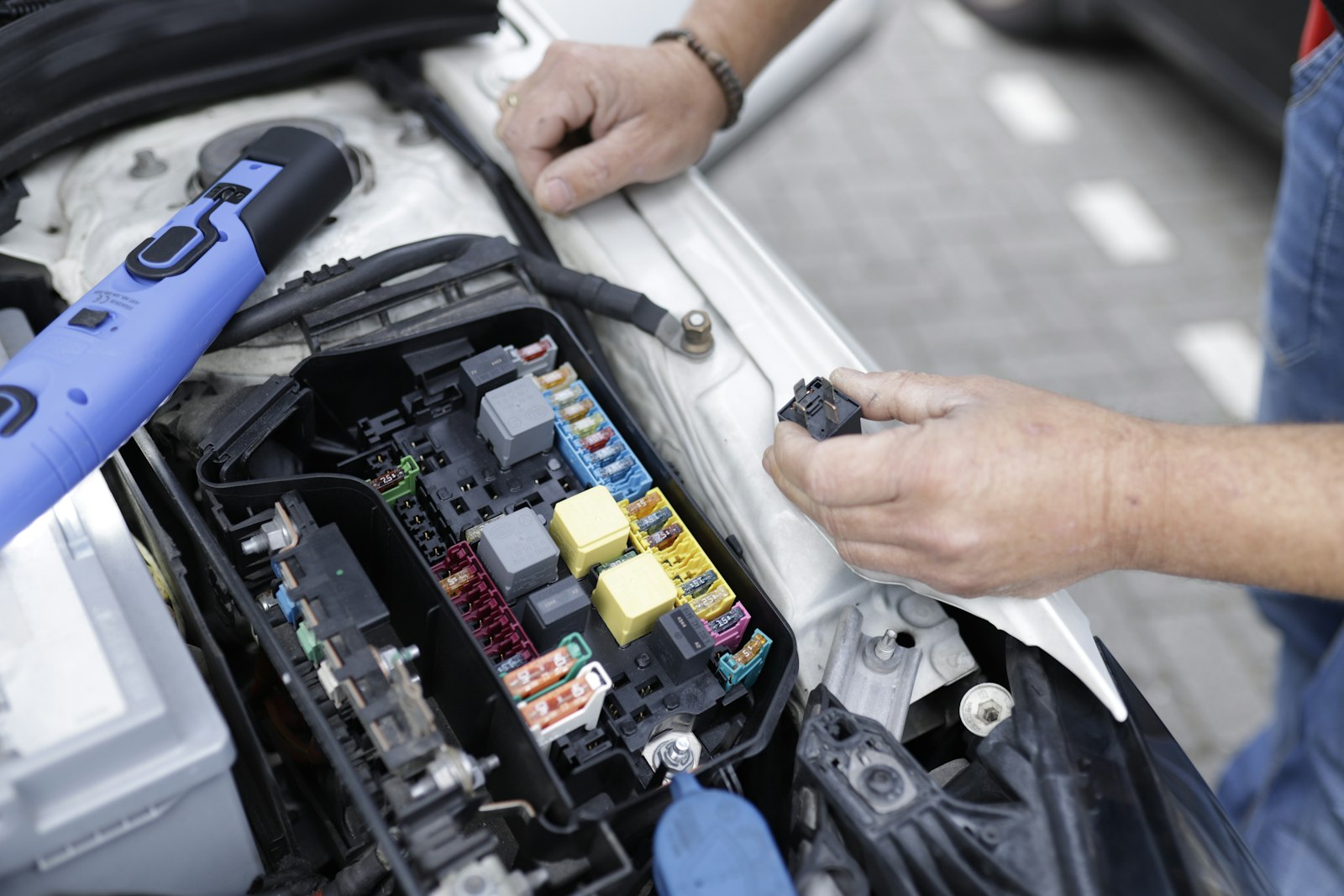 A technician diagnosing an engine