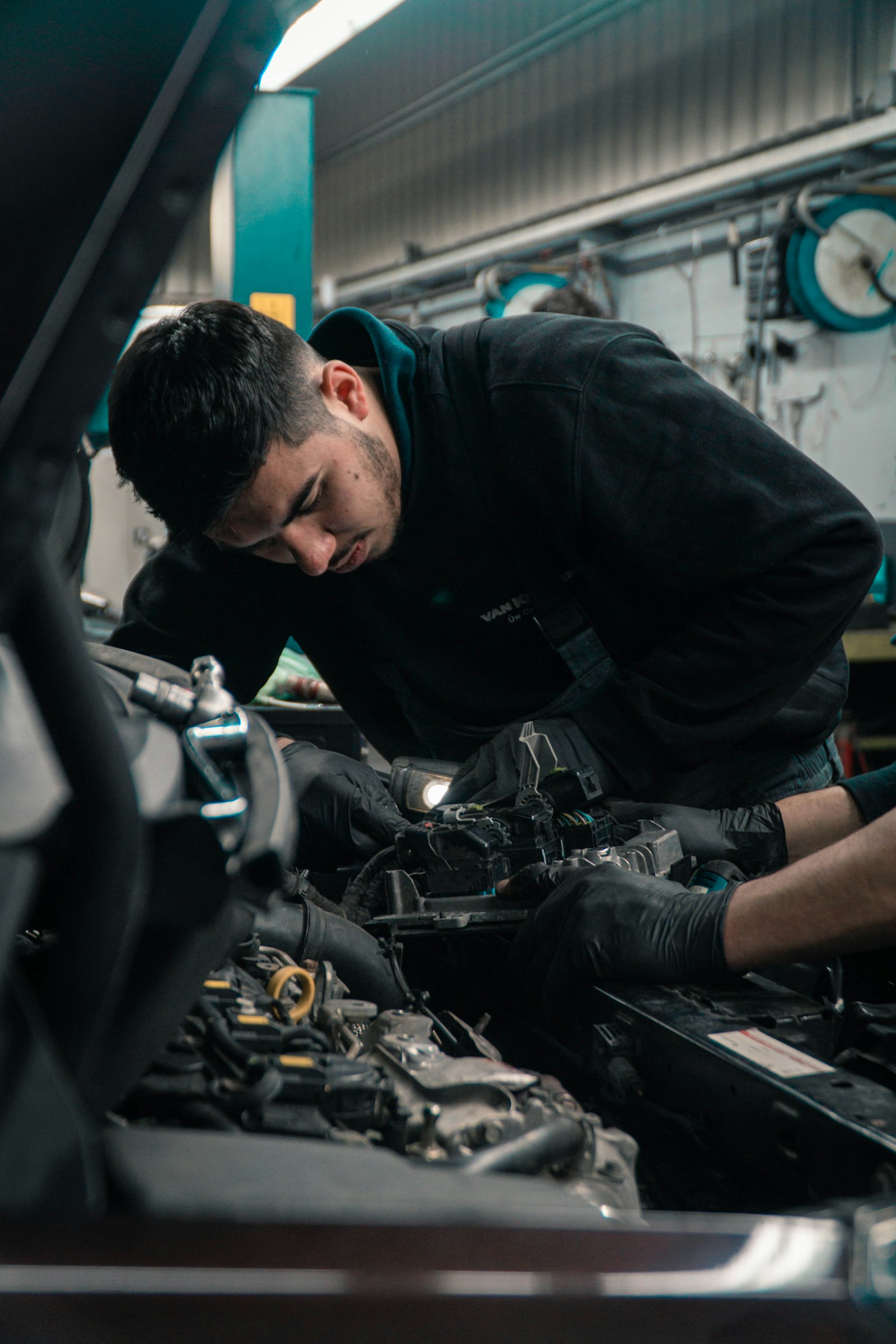 A technician working on an engine